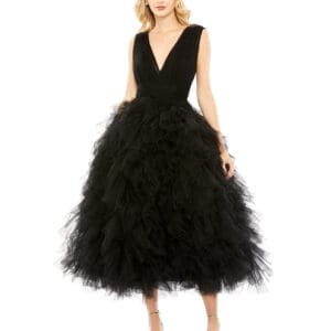 A woman stands in heels against a white background wearing a black Ruffled Cap Sleeve V-Neck A Line Tulle Dress.