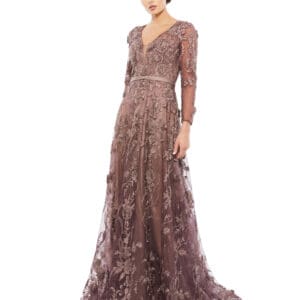 A person is wearing an Embroidered Long Sleeve Plunge Neck A-Line Gown in mauve.