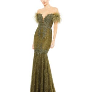 A person stands against a white background wearing a Green Feathered Crystal Embellished Sleeveless Gown.