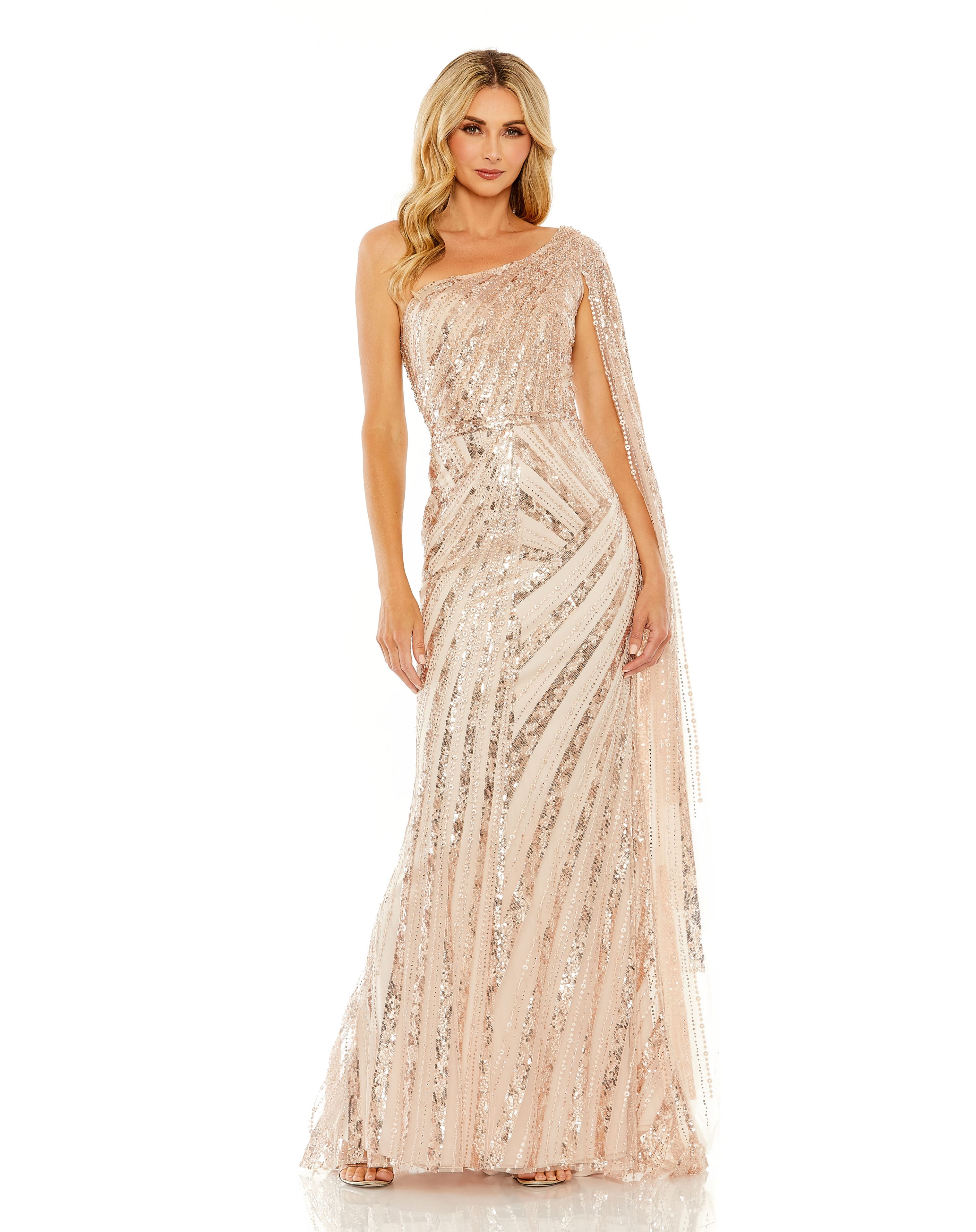 A person wearing the Rose Gold One Shoulder Cape Sleeve Embellished Gown, adorned with sequins and a geometric pattern.