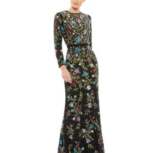 A person in the Floral Embellished Long Sleeve Gown poses against a plain white background, showcasing its form-fitting design and colorful floral embroidery.